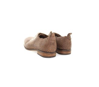 Handmade woman`s lace-up shoes in woven genuine leather